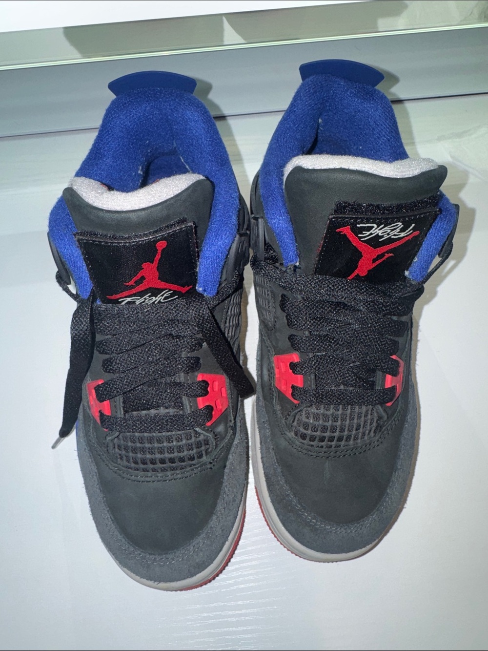 Jordan Kids Black Sneakers with Blue Lining and Red Accents